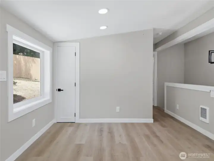 View of the pantry and hallway to bathroom and stairwell