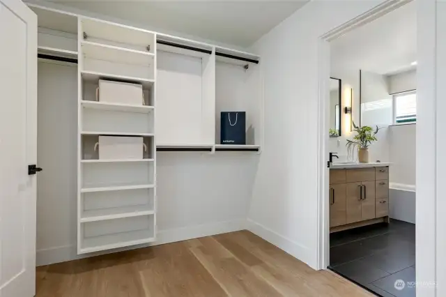Stay organized with custom closet organizers in the primary closet. Maximize space and efficiency while keeping your wardrobe tidy and accessible.
