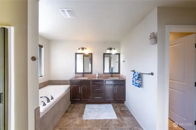 Stunning bathroom featuring both a separate bathtub and shower for ultimate relaxation and convenience