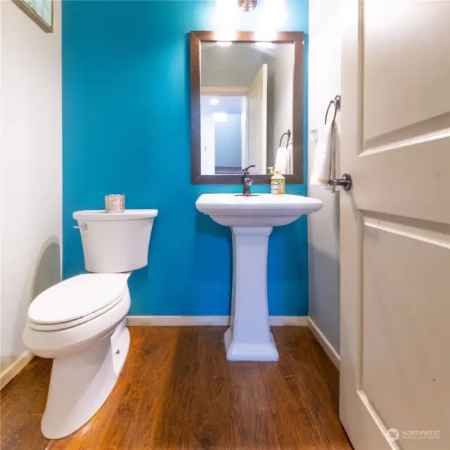 Practical half bathroom, offering added convenience and comfort