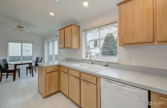 Kitchen flows into bright, spacious breakfast room