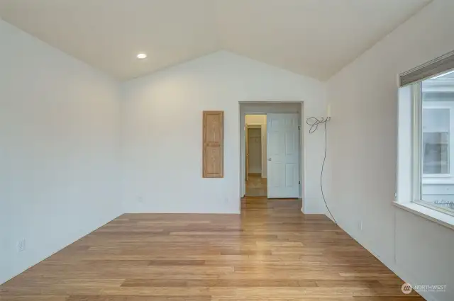 Primary bedroom enjoys a MASSIVE walk-in closet (entrance in background)