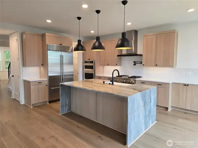 Gourmet Kitchen with Quartzite Island, and Designer Pendants