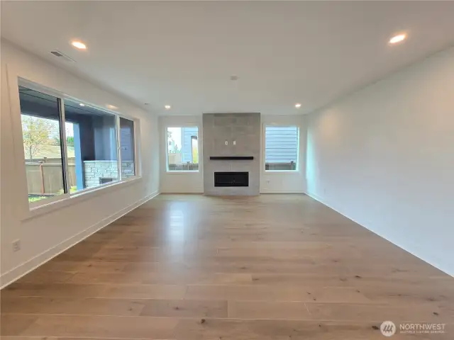 Huge Living Room with Cozy, Gas Fireplace.  Features Designer Tile and Mantle