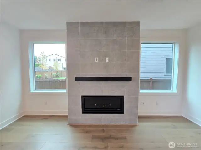 This Cozy Gas Fireplace  Features Designer Tile and Mantle