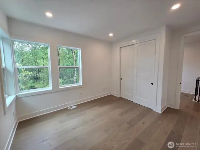 Secondary Bedroom Upstairs with Gorgeous views of Green!