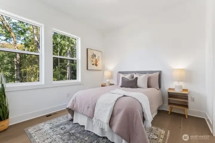 Guest bedroom with lovely views out the windows of the open space- Tranquill