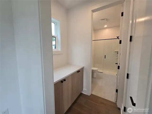 Cabinets In between Secondary Guest Suite and Bath.