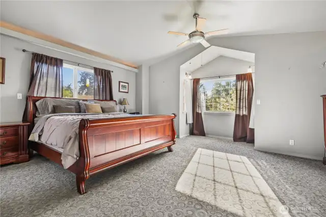 The entire upstairs is dedicated to a spacious primary suite, offering peaceful views of the beautifully landscaped backyard