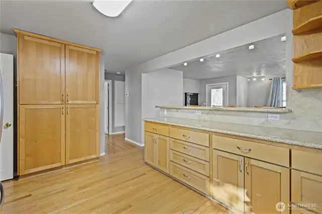 Charming built-in pantry offers both style and functional storage.