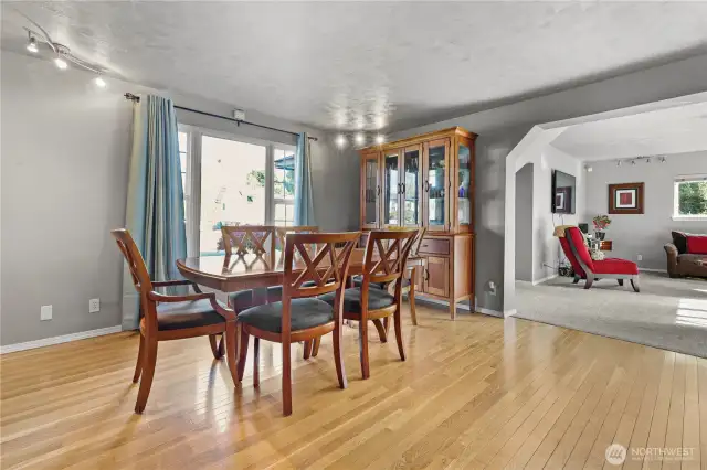 The dining room gracefully opens into the living room, enhancing the flow and creating an inviting space for relaxation and socializing.