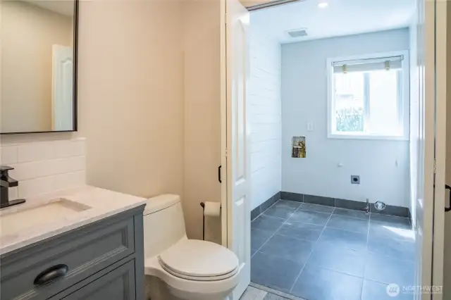 Powder room and great hidden laundry room.