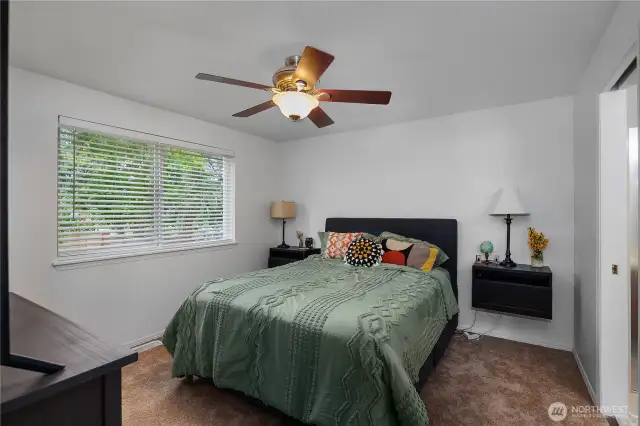 The primary bedroom features a ceiing fan to keep things comforatable, plus brand new carpet and blinds for a fresh, clean feel.