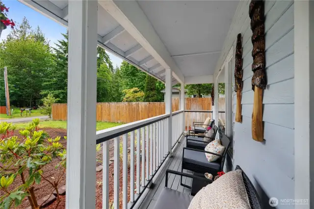 Welcoming front covered porch-perfect for sipping your morning coffee while taking in peaceful views of the yard.