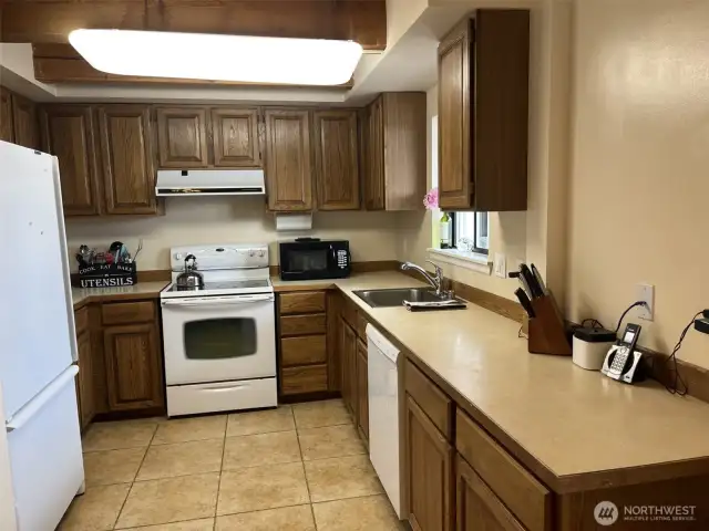 Kitchen with lots of cabinets.