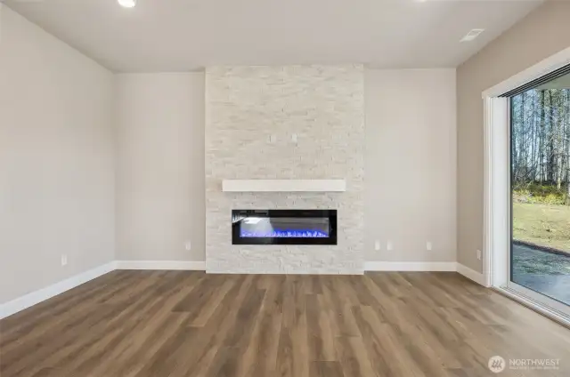 Photos not of actual home- lot 4 will have built in shelving on either side of the fireplace
