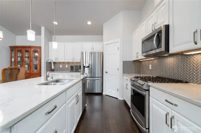 Kitchen has upgraded appliances.