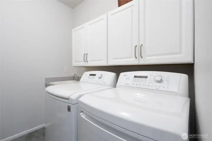 Laundry room with storage.