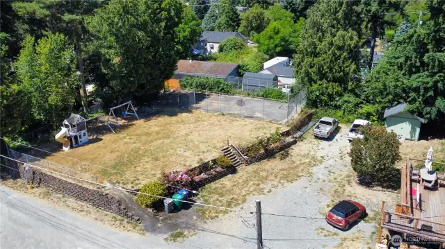 Large flat yard and sports court.