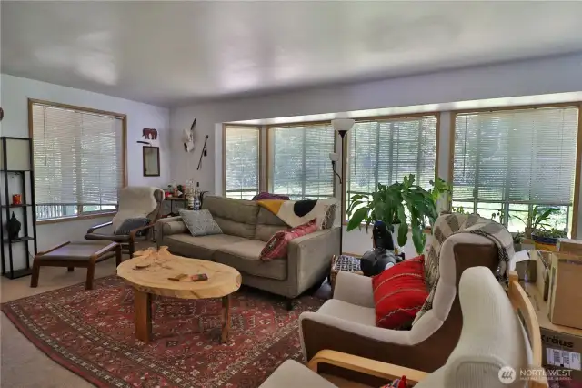 Spacious living room, large widows for natural light.