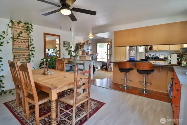 Family room off of the kitchen is currently used as a dining room.