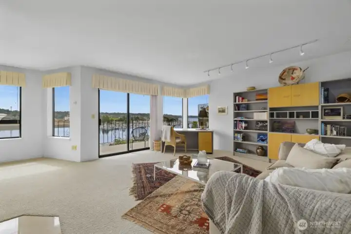 The living room lighting was installed to highlight the bookcase and artwork. It’s a plugin fixture, so removal would be fairly simple if you would prefer alternative lighting.