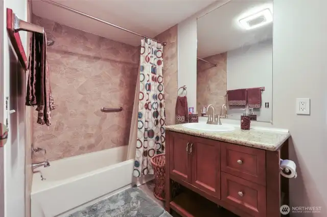 Primary bathroom includes closet for linens and storage.