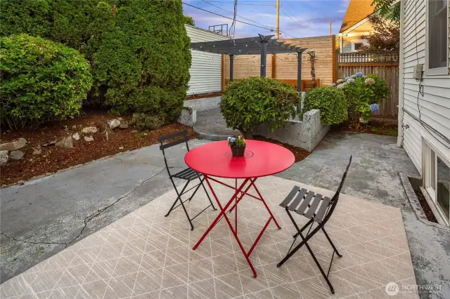 Fenced backyard with patio.