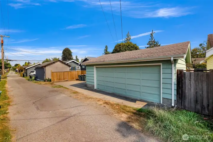 Machine grooved old growth cedar siding and fresh paint on all of the home and garage's exterior