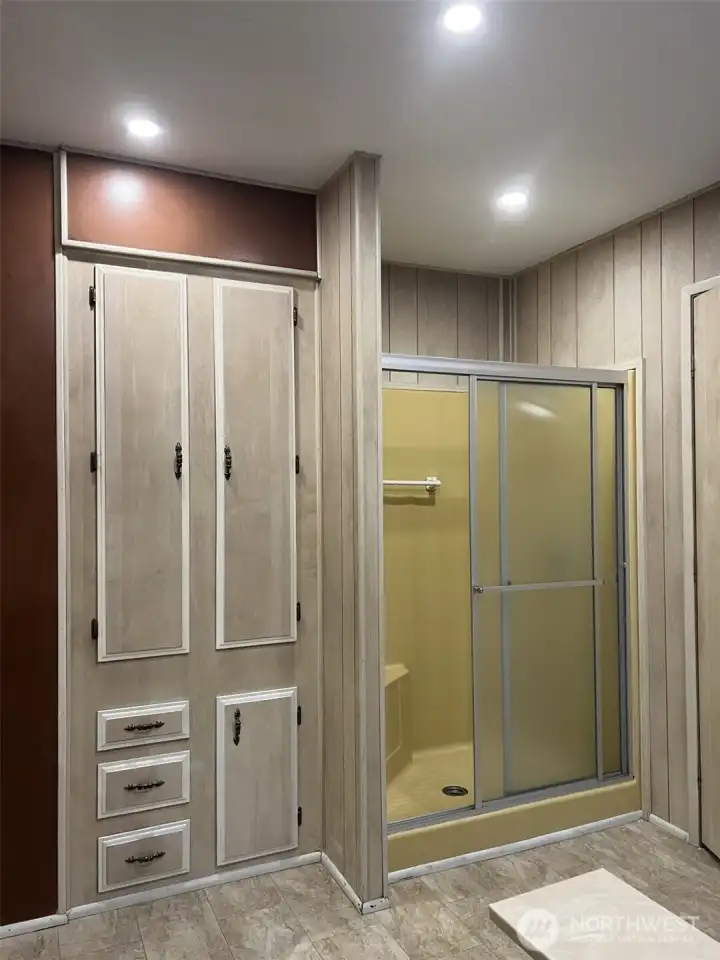 Primary 5 piece bathroom with Soaking Tub, Walk in Shower, And plentiful storage!