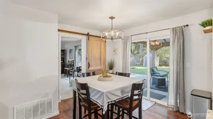 Dining nook with sliding glass door to covered patio.      Barn door can close off this space from the adjoining family room