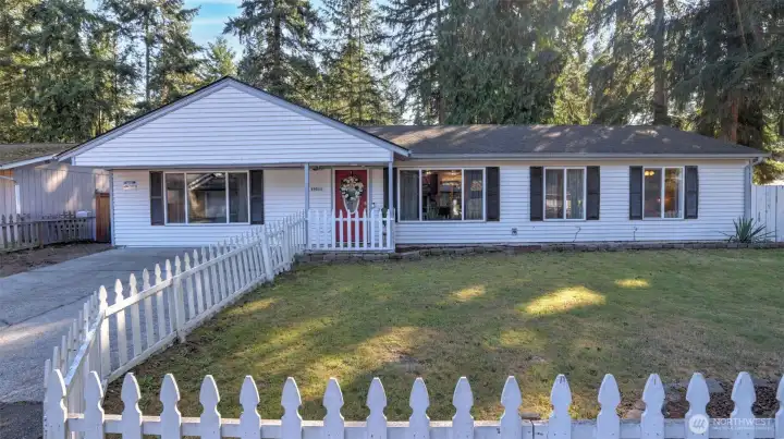 Total curb appeal complete with white picket fence!