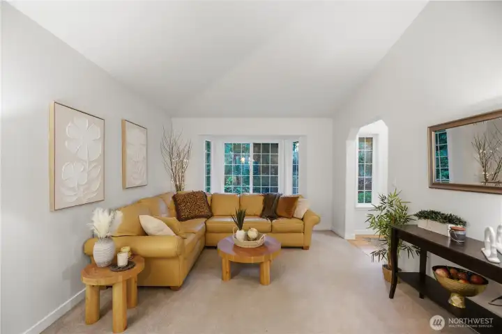 Vaulted ceilings and open flow from living to dining, Ideal for every day comfort and perfect for entertaining.