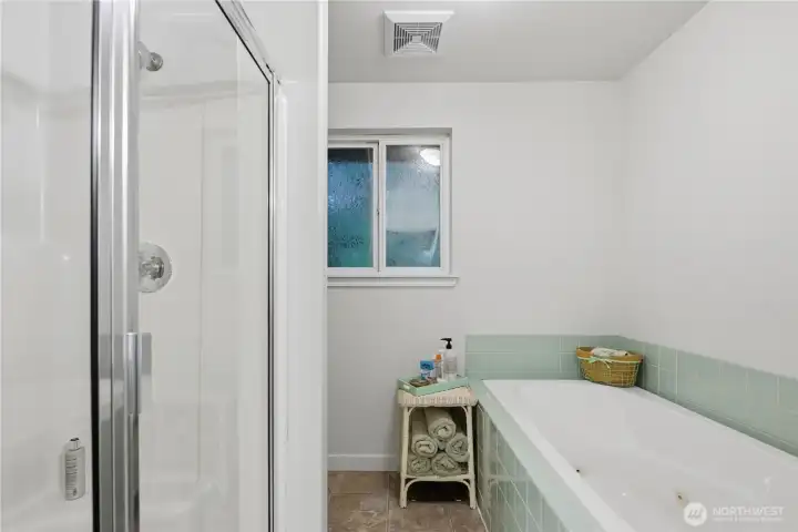 Relax and refresh in your private bath, featuring both a walk in shower and a soaking tub, and heated towl rack.