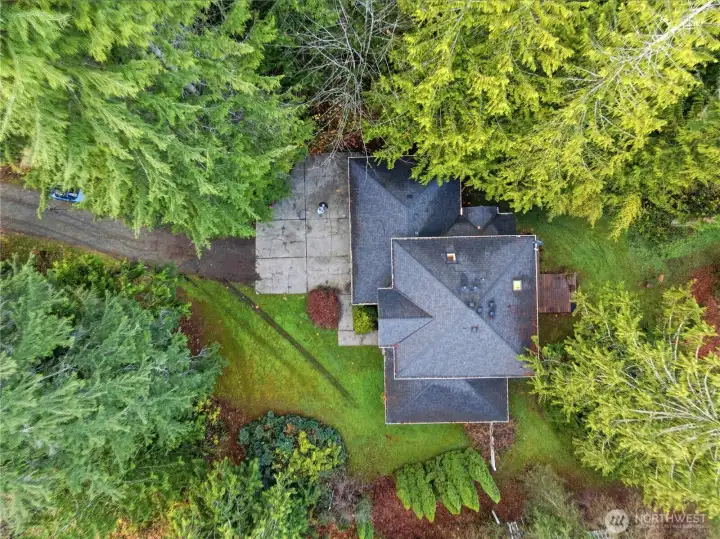 Tucked into almost 5 acres of natural beauty the home offers unmatched privacy, and Pacific Northwest serenity.