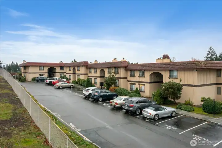Each condo has a reserved parking space and there is a nice buffer of landscape around the building