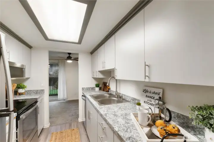 There is plenty of counter space for creating wonderful meals plus updated stainless steel appliances & sink/faucet