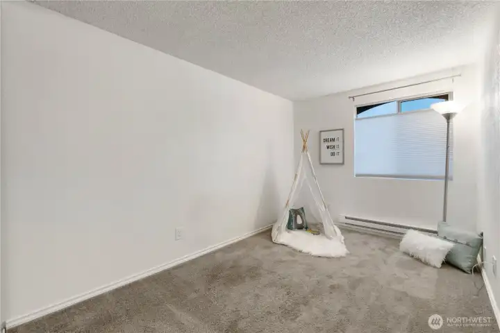 The bedrooms are large and feature top-down bottom-up blinds so you can enjoy light and privacy. The closet is located to the left