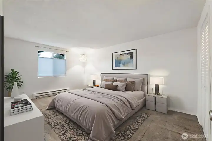 The primary suite is spacious with a walk-in closet leading to the attached bath. *Photo is virtually staged