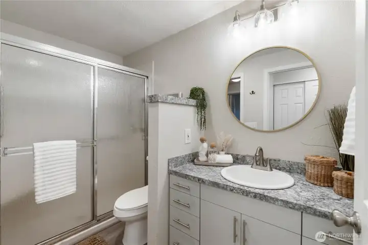 The generously sized shower has a small bench seat & low step-in access for ease of use