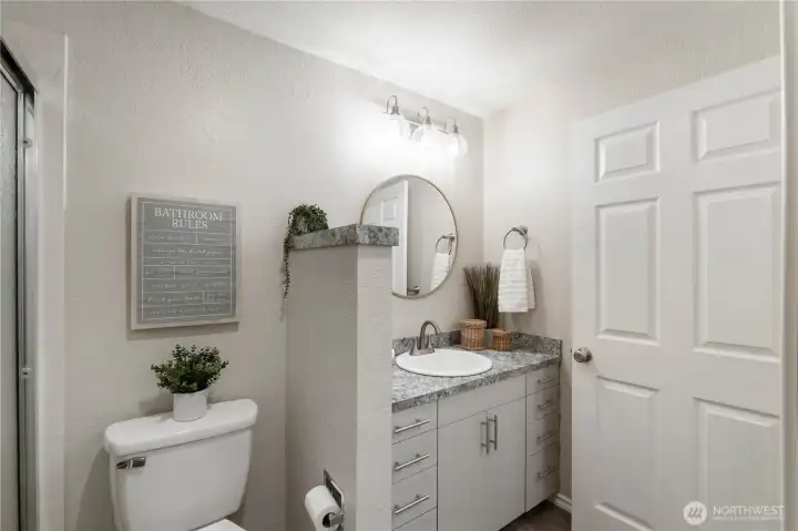 Nice doors & trim are featured throughout the home. This door leads to the hallway so the bath can be accessed two ways