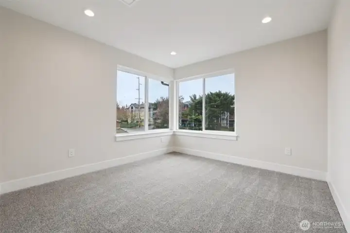 Another angle of fourth bedroom with multiple windows