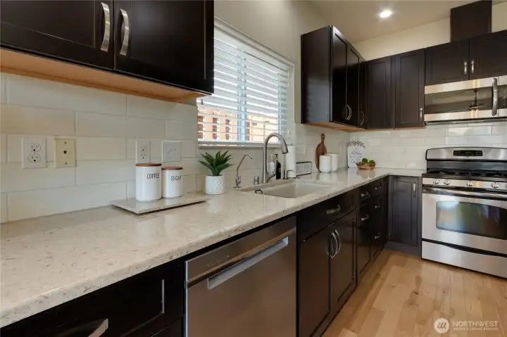 Pretty countertops & stainless steel appliances.