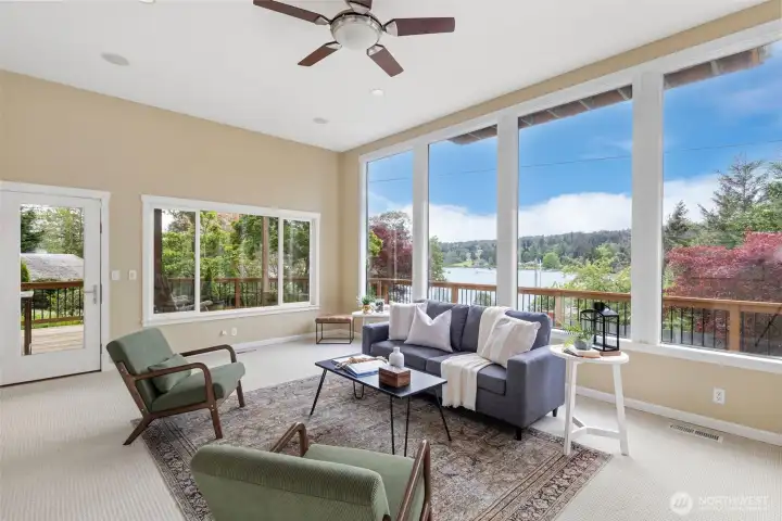 These amazing 8 foot windows are perfect way to enjoy light, nature and water views of this lovely home. Also a peek of the great deck outside