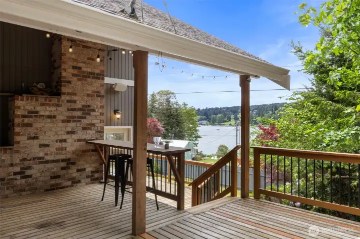 Right off of the Kitchen the grand deck offers this levely covered area where you canennjoy the views, food, company even when is pouring out