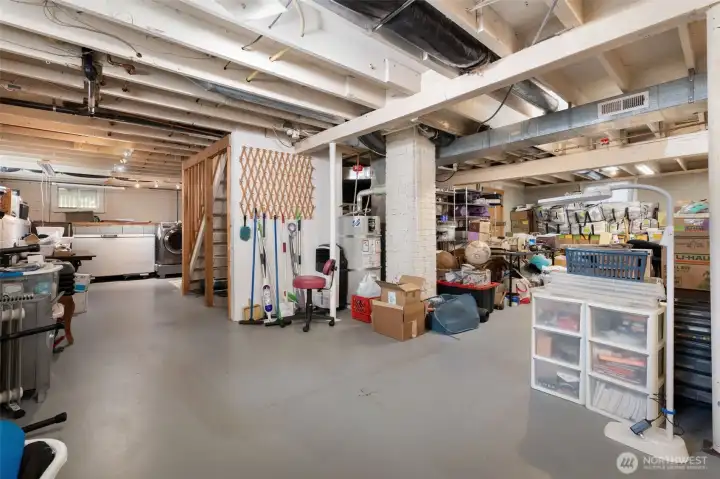 High ceilings in basement should make it easy to finish to living space. Tons of potential here!