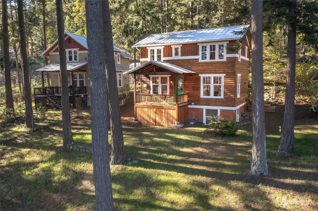 South side of the home showcasing the sunny deck and south facing windows.