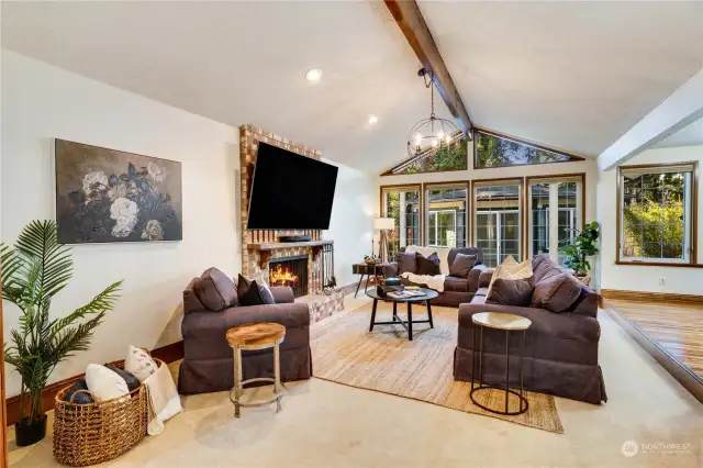 This home has two fireplaces, vaulted ceilings and windows that bring in the nature and light.