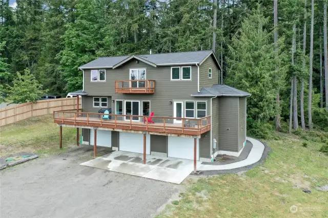 Stunning views of the Olympic Mountains from your HUGE deck! Upper deck has fantastic views of the Hood canal too!  Partially fenced 3.21 acres  With TONS of room to grow!