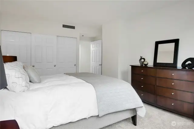 Spacious bedroom could easily fit a king sized bed. This is a Queen bed. Room for a large dresser plus 2 night stands.